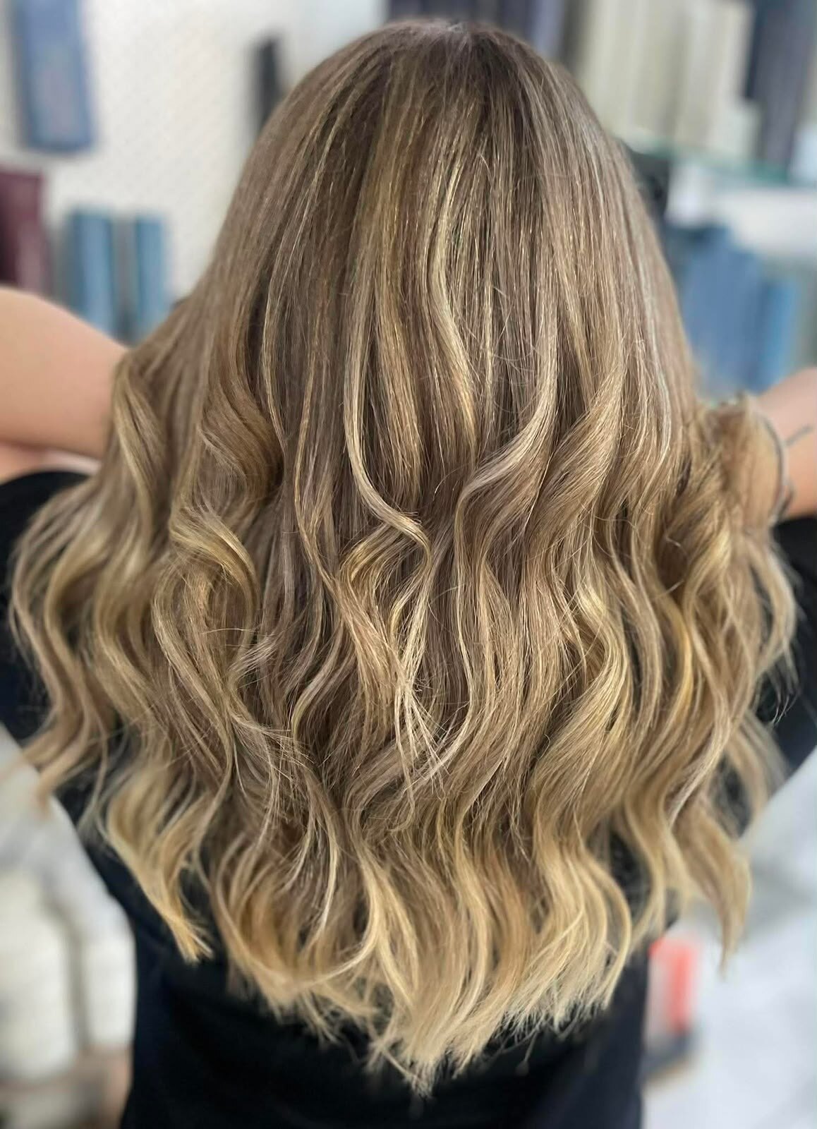 Soft blonde balayage waves finished at Arty Hair Studio
