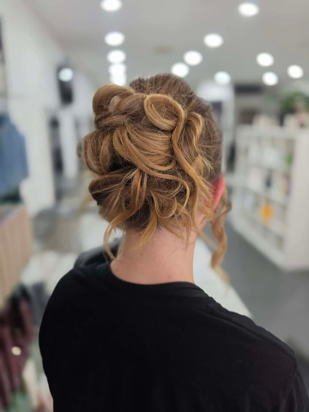 An elegant updo bun created at Arty Hair Studio
