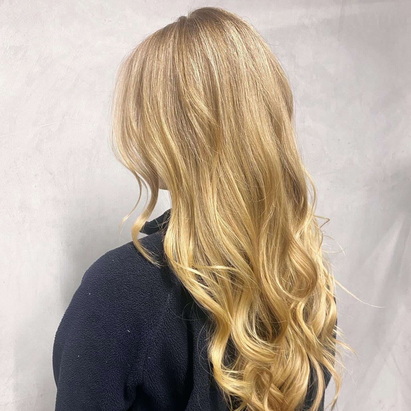 Soft blonde waves coloured and finished at Cutters His & Hers Hairdressing