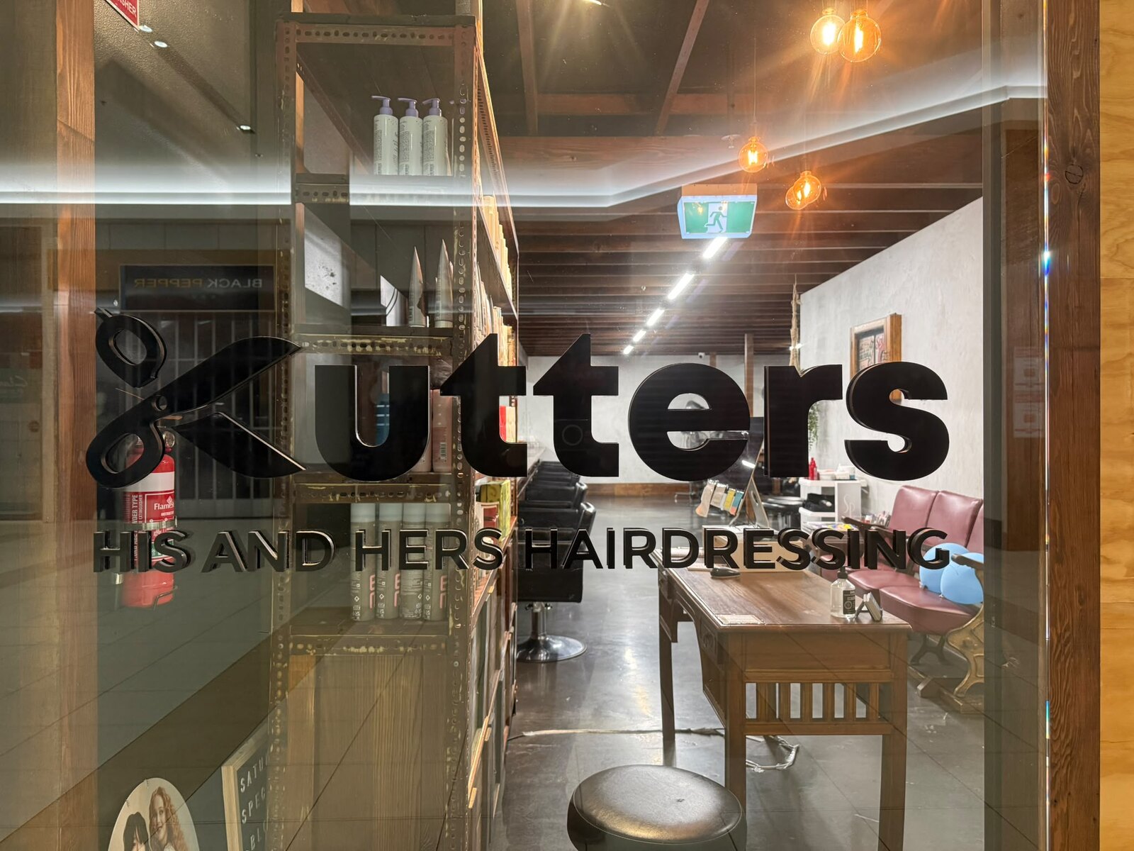 Cutters His & Hers window signage at the Forest Hill salon