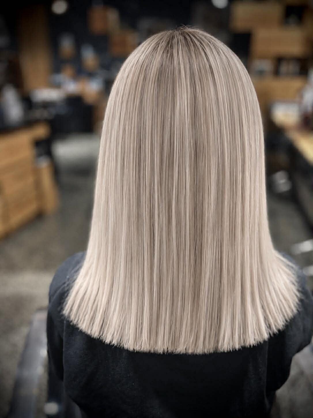 Platinum blonde lob styled by a Hair Station stylist